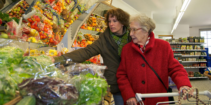 older lady being helped with shopping